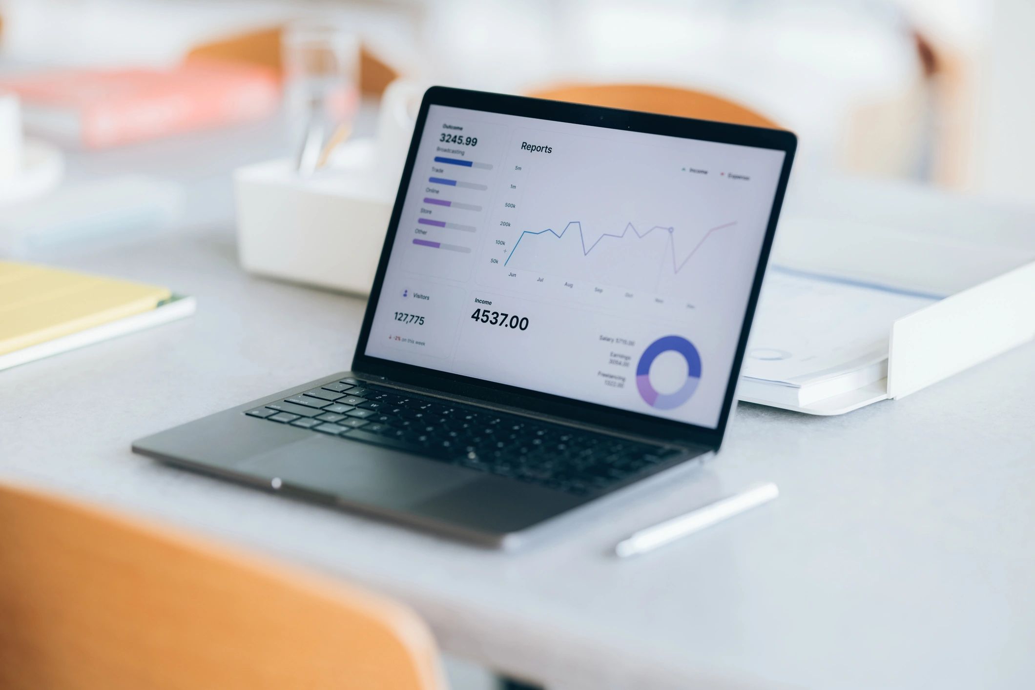 Financial reporting and analytics on a laptop in an office